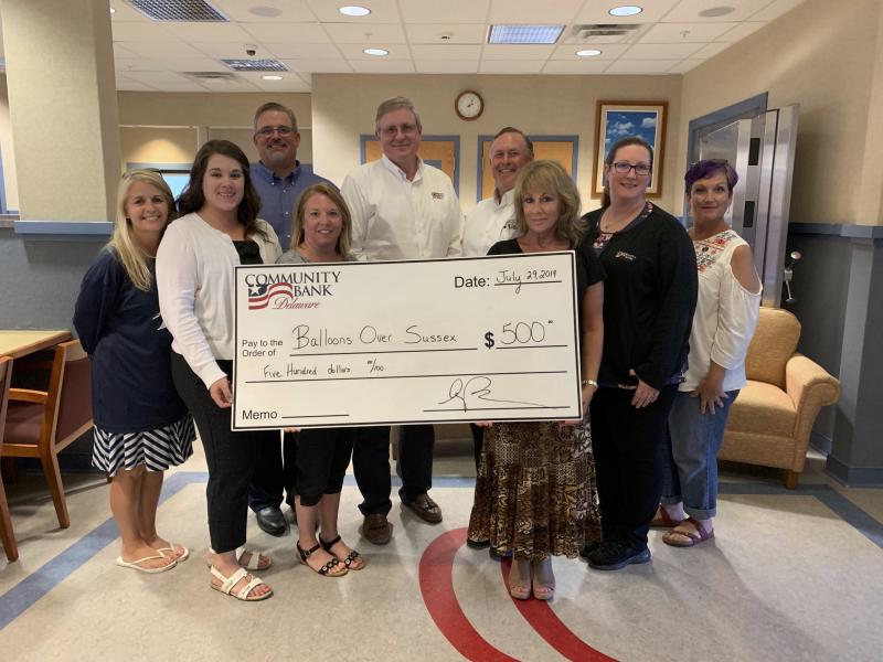 Check presentation attendees shown are in back (l-r) Assistant Vice President Steve Onuschak, President Jack Riddle, Vice President Chris Benjamin, Assistant Lender Laura McKenzie and event Co-Chair Bobbi Sherman. In front are Sussex Academy Director of Development Gina Derrickson, Assistant Branch Manager Amynda Verderame, Chief Financial Officer Angie Warrell and Assistant Vice President Lori Ruberti. SUBMITTED PHOTO
